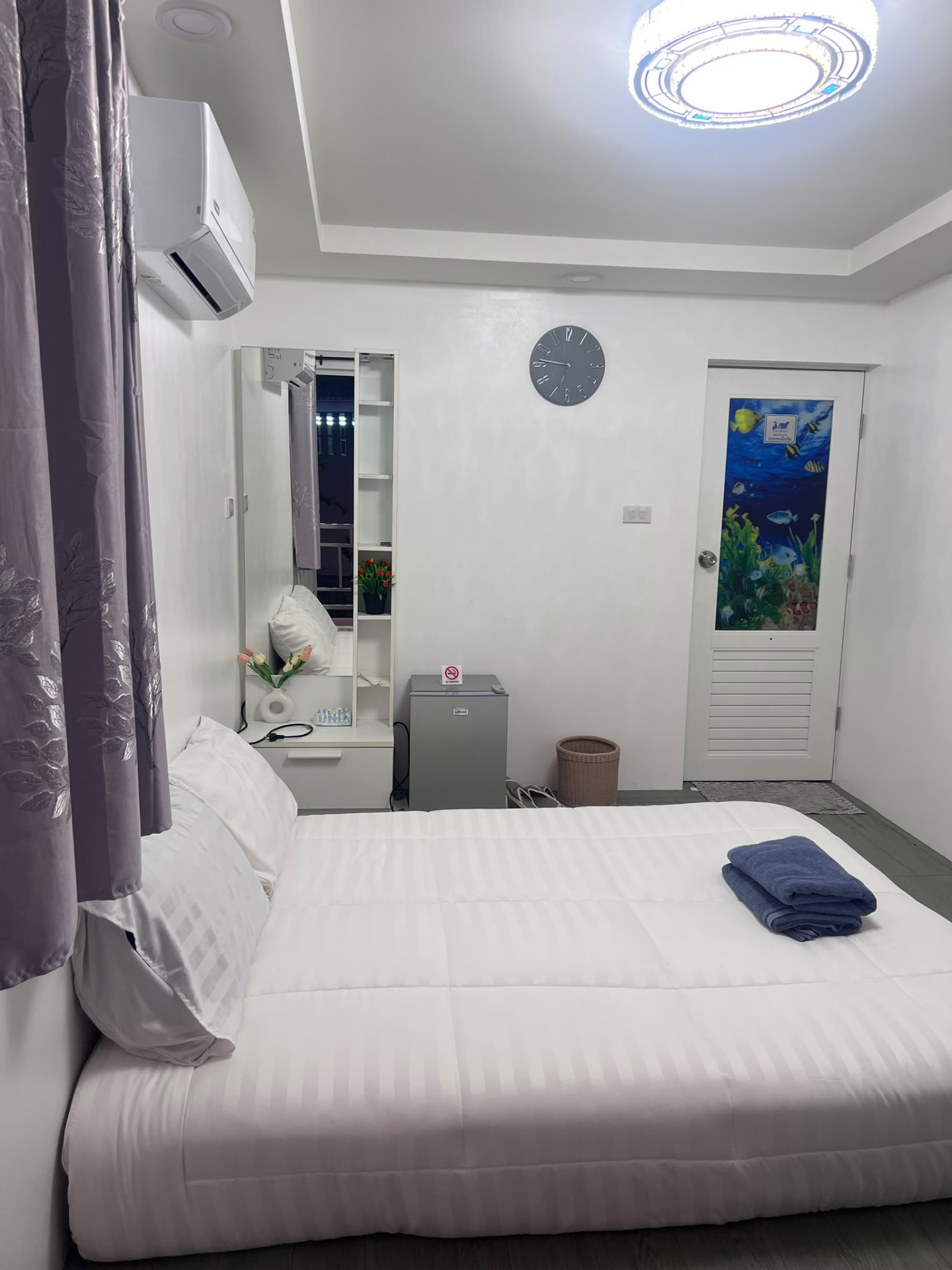 Conventional guest room at Wanasa with a neatly made bed